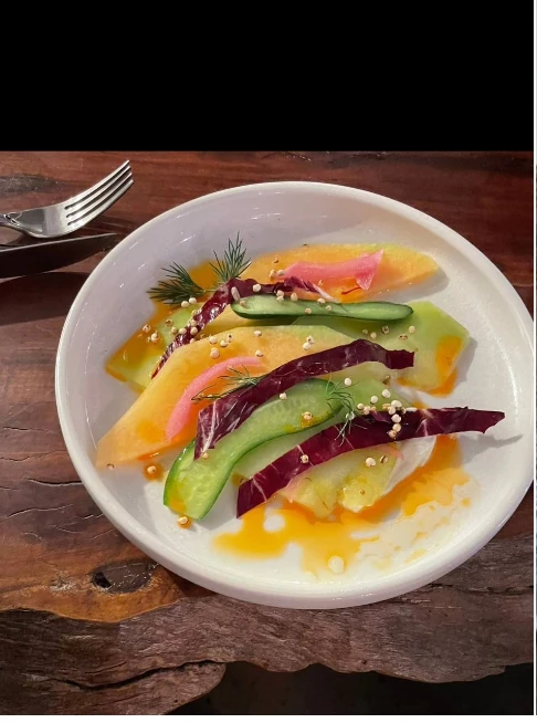 Colourful vegetable course on a ceramic plate